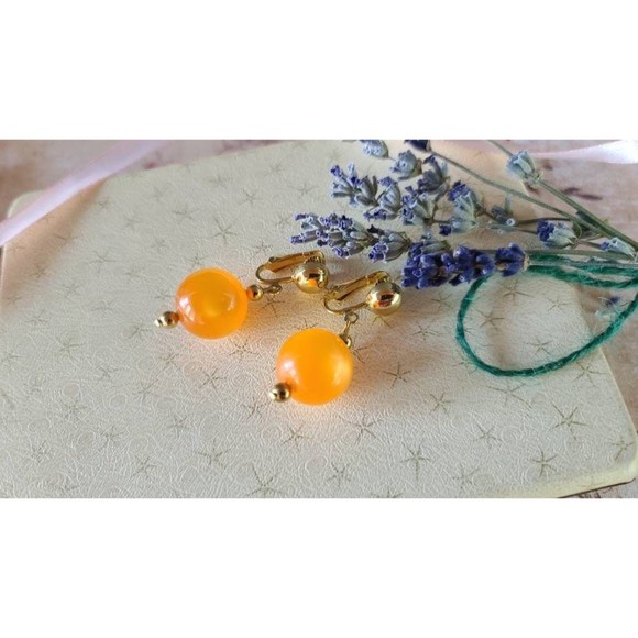 Celebrity Orange Dangling Clip-on Earrings - Picture 6 of 10